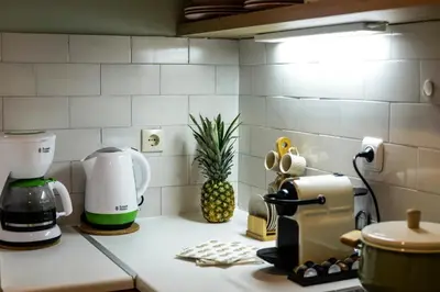 a kitchen counter with a coffee maker and a mixer at Your 