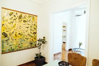 a large painting of birds on a wall in a room at we saw athens in Athens