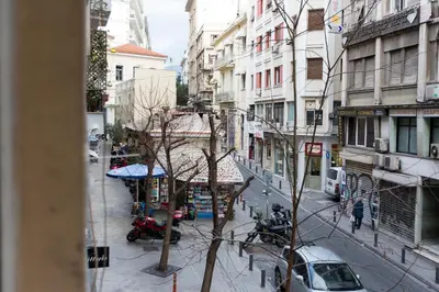 a view from a window of a city street at we saw athens in Athens