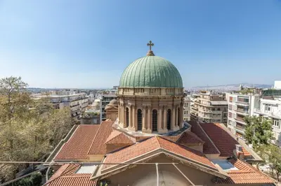 a building with a green dome on top of it at TOP Kolonaki Studio+Terrace Stunning Acropolis Views in Athens