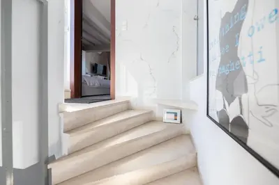 a staircase in a building with a mirror at TOP Kolonaki Studio+Terrace Stunning Acropolis Views in Athens