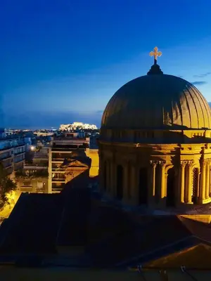 a building with a cross on the top of it at TOP Kolonaki Studio+Terrace Stunning Acropolis Views in Athens
