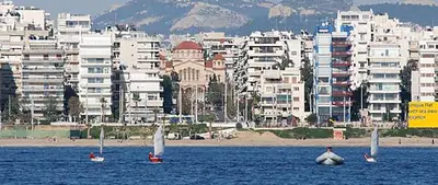 three boats in the water in front of a city at Unique Flat with Sea View at Edem Beach - A Seafront Property by Athenian Homes in Athens