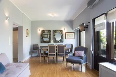 a dining room with a table and chairs at Beautiful Penthouse in Athens with outdoor jacuzzi in Athens