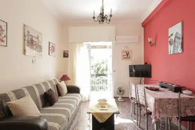 a living room with a couch and a table at KOKONI APARTMENTS AMBELOKIPI, ATHENS in Athens