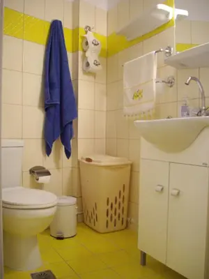 a bathroom with a toilet and a sink at KOKONI APARTMENTS AMBELOKIPI, ATHENS in Athens