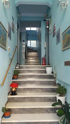 a set of stairs in a building with plants at KOKONI APARTMENTS AMBELOKIPI, ATHENS in Athens