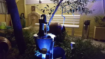 a blue light on a tree in a room at KOKONI APARTMENTS AMBELOKIPI, ATHENS in Athens