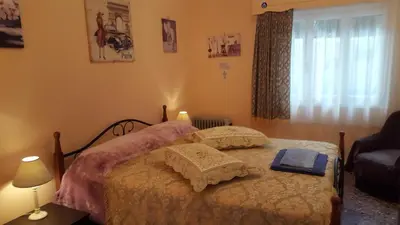 a bedroom with a bed with two pillows at KOKONI APARTMENTS AMBELOKIPI, ATHENS in Athens