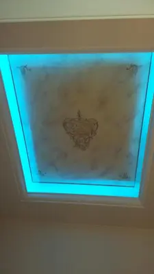 a ceiling with a painting of a seal on it at Exis Hotel in Athens