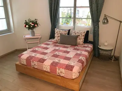 a bedroom with a bed with a quilt on it at Dina's House in Spáta