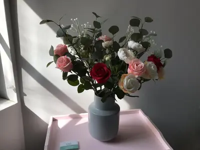 a vase filled with flowers sitting on a table at Dina's House in Spáta