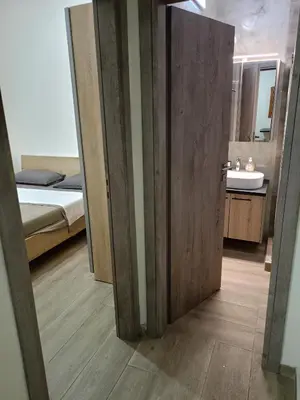 a room with a bathroom with a bed and a sink at Athens Center Cosy Apartment in Athens