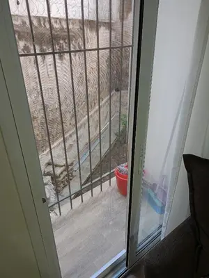 a sliding glass door with a view of a yard at Athens Center Cosy Apartment in Athens