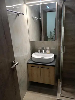 a bathroom with a sink and a mirror at Athens Center Cosy Apartment in Athens