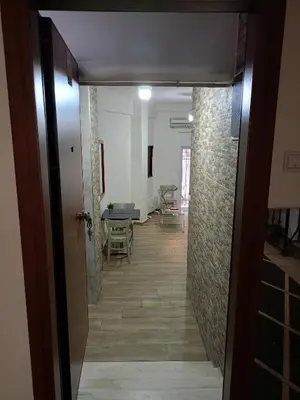 a hallway leading to a living room with a table at Athens Center Cosy Apartment in Athens