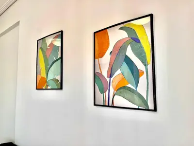 two pieces of art hanging on a wall at Elvita Apartments 2 in Athens