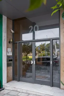 an entrance to a building with a twenty sign on the door at Parthenon Apartment in Athens