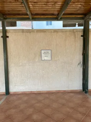 a room with a sign on a wall at Hector Apartment Airport by Airstay in Spáta