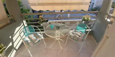 an overhead view of a table and chairs on a balcony at Athens Metro Mall Apart in Athens