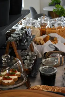 a table topped with lots of different types of food at Be My Guest Athens in Athens