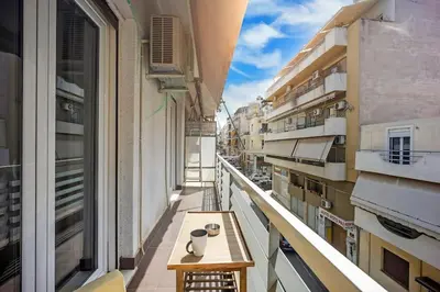 an empty balcony with a table on a building at Apartment in the Middle of Everything in Athens