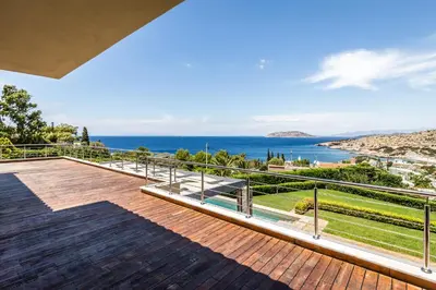 a view of the ocean from the balcony of a house at Analisa Luxury Villa in Sounio