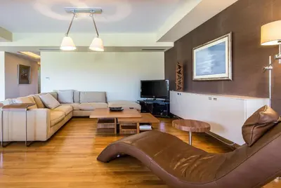 a living room with a couch and a table at Analisa Luxury Villa in Sounio
