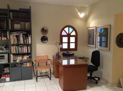 an office with a desk and chairs and a window at Filyra Homestay (Όμορφο δωμάτιο σε σπίτι) in Athens