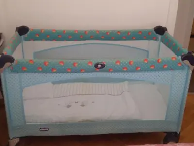 a blue crib with red and green polka dots at Stunning apartment in the heart of Athens in Athens