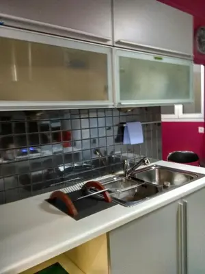 a kitchen with a sink and a counter top at Stunning apartment in the heart of Athens in Athens