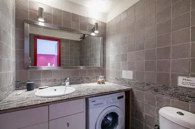 a bathroom with a washing machine and a sink at K5 - Walk into Heritage in Athens