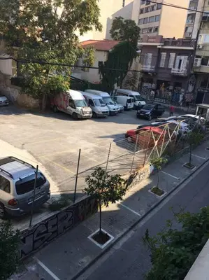 a view of a parking lot with parked cars at K5 - Walk into Heritage in Athens