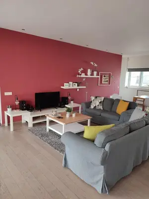 a living room with two couches and a red wall at K5 - Walk into Heritage in Athens
