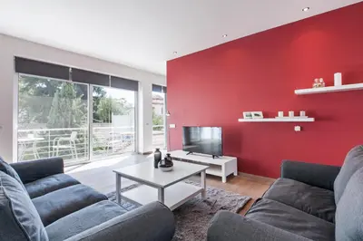 a living room with two couches and a red wall at K5 - Walk into Heritage in Athens