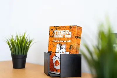 a box of kitten attack bar on a table with a plant at Stone Palace Hotel Near Athen's Airport Free Shuttle From and to Athen's Airport in Spáta
