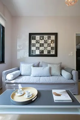 a living room with a couch and a table at Under the shade of Acropolis by YHA in Athens