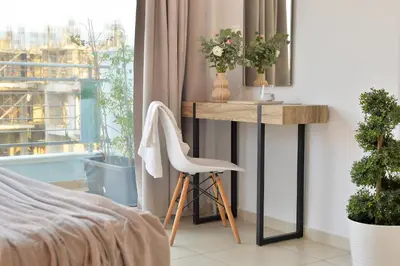 a bedroom with a desk and a chair next to a window at Alekos Apartments 1 - Νetflix & Comfort in Athens