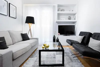 a living room with a couch and a table at Lux Central Apt at Kolonaki Area in Athens