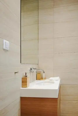 a bathroom with a white sink and a mirror at Lux Central Apt at Kolonaki Area in Athens