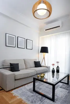 a living room with a couch and a coffee table at Lux Central Apt at Kolonaki Area in Athens