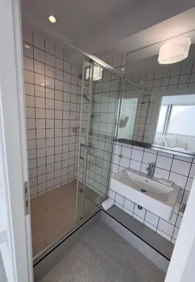 a bathroom with a sink and a mirror at Euryclea Residences in Athens