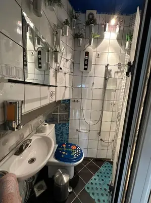 a small bathroom with a sink and a toilet at Athens centre diamond in Athens
