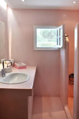 a bathroom with a sink and a window at Sarwnisland in Lagonissi