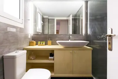 a bathroom with a sink and a toilet at Athens Vintage Apartment - Pagrati in Athens