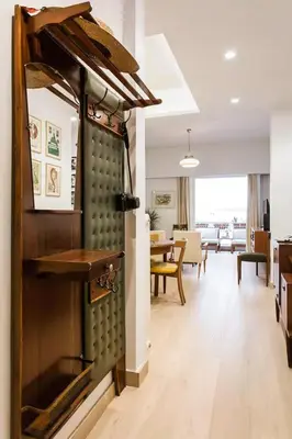 a living room with an oven and a dining room at Athens Vintage Apartment - Pagrati in Athens