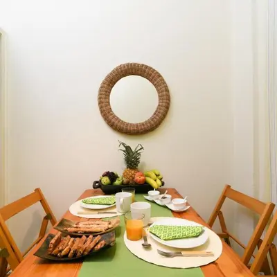 a table with a plate of food and a mirror at Classy Apartment in the Heart of Athens in Athens