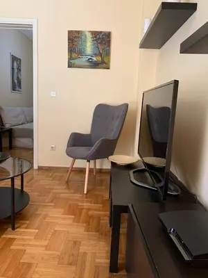 a living room with a desk and a chair at Renovated cozy apartment near to Acropolis in Athens