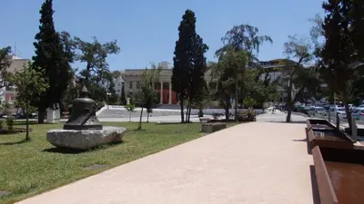 a park with a statue in the middle of a sidewalk at The Grove House in Athens
