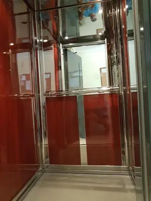 a glass shower with a mirror in a room at Errathens Zephyr Apartment - Athens Center, 3 BD, 1 BATH in Athens